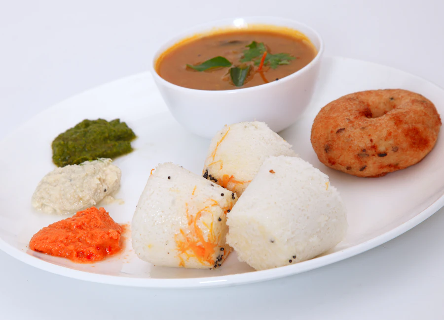 Soft idli and medu vada served with sambar and chutneys